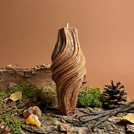 Wooden candle holder on a rustic background with pinecones and leaves